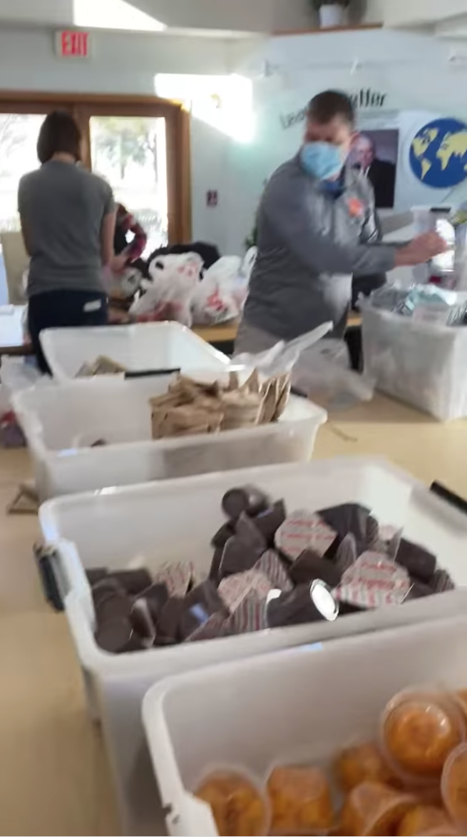 volunteers packing tiger packs